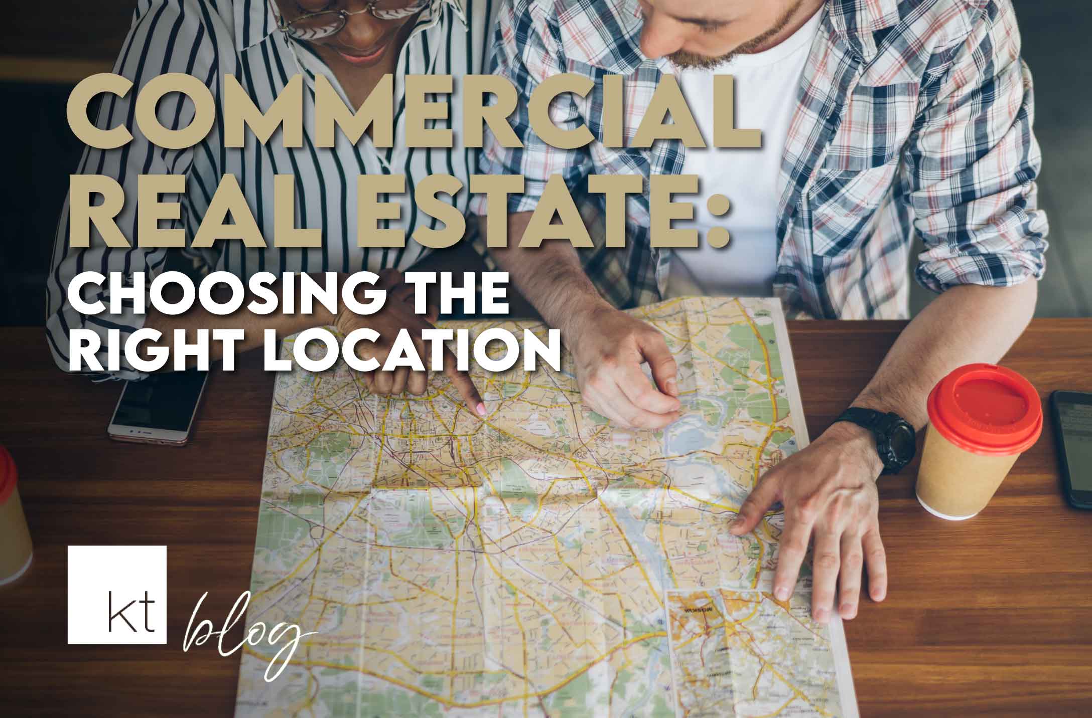 Professional couple looking at a map for the location of buying commercial real estate