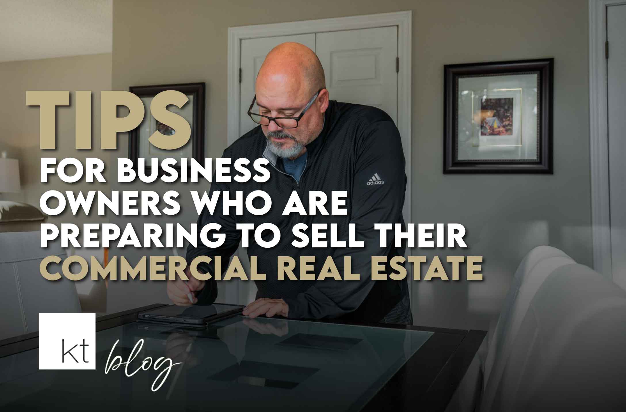 Commercial real estate agent, steve cecchetto, signing a commercial real estate deal at a countertop.